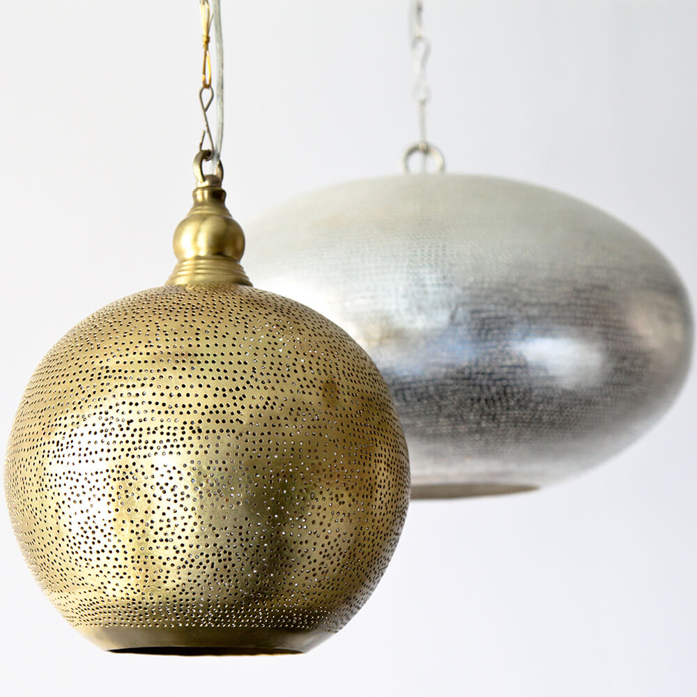 egyptian pendant lights, with pierced metal surface.