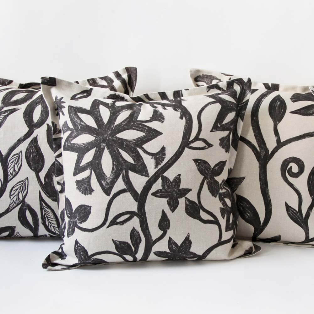 linen khovar throw pillows with oversized floral pattern.