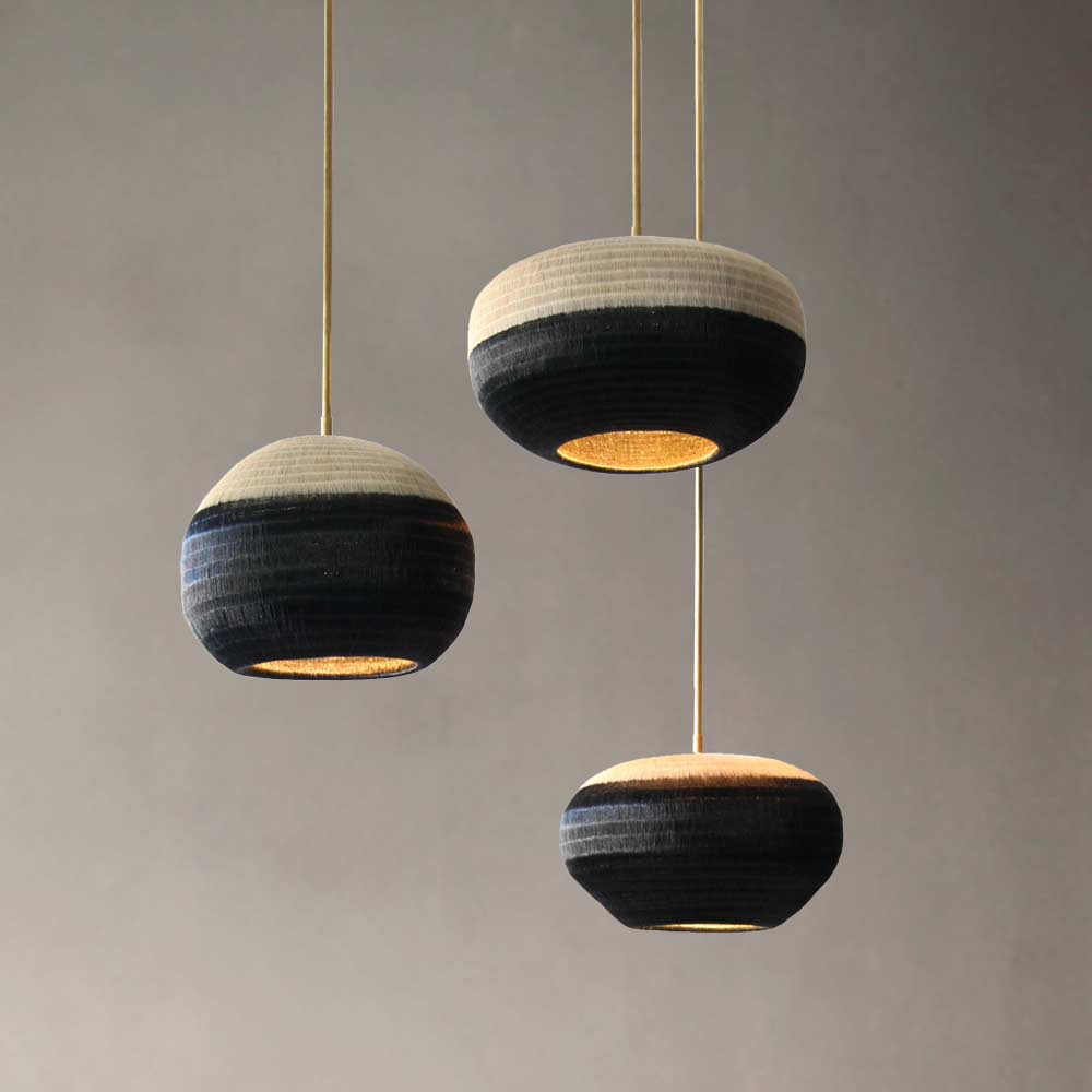 werregue woven pendant lights. giving off a soft, warm ambient light, the perfect mood lighting.