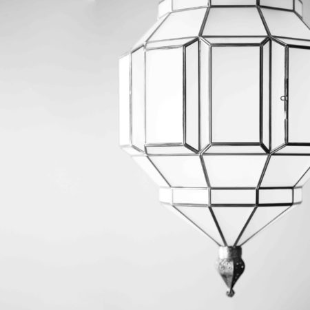 silver and milk glass pendant light, a modern take on traditional moorish style.