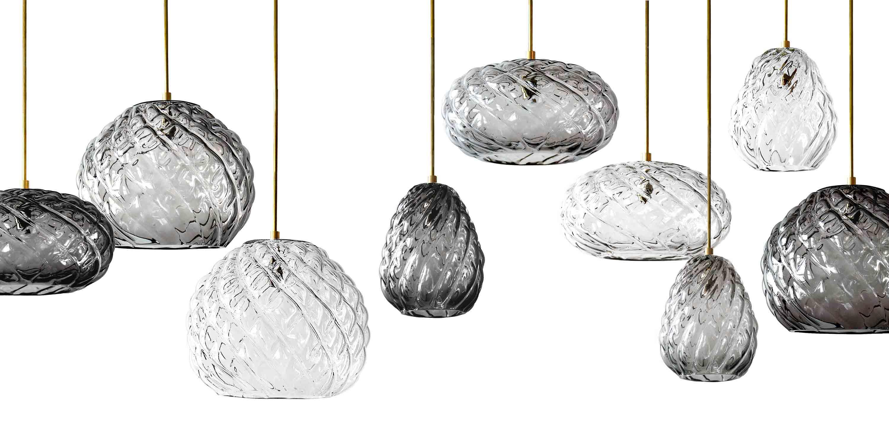 agave lighting collection, handblown glass pendant lights in clear glass, smoke glass, and charcoal glass.