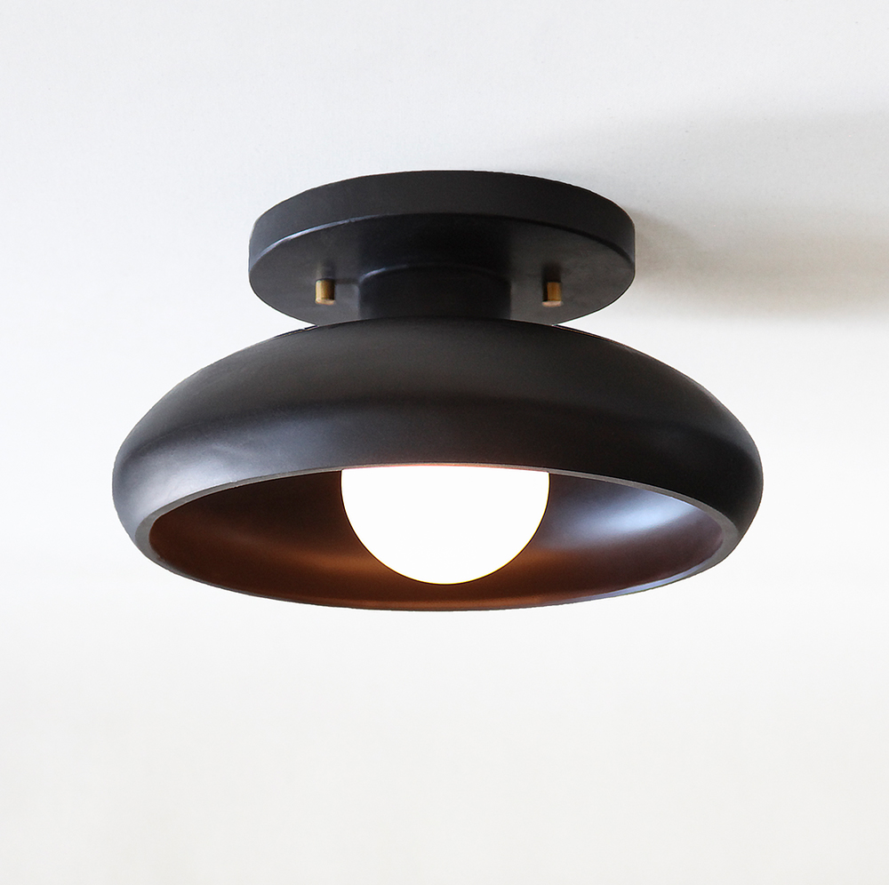 lit modern stone ceiling semi-flush mount light fixture in black onyx and a tala bulb.