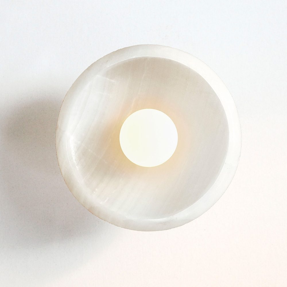 lit modern stone ceiling semi-flush mount light fixture in milk white onyx and a tala bulb.