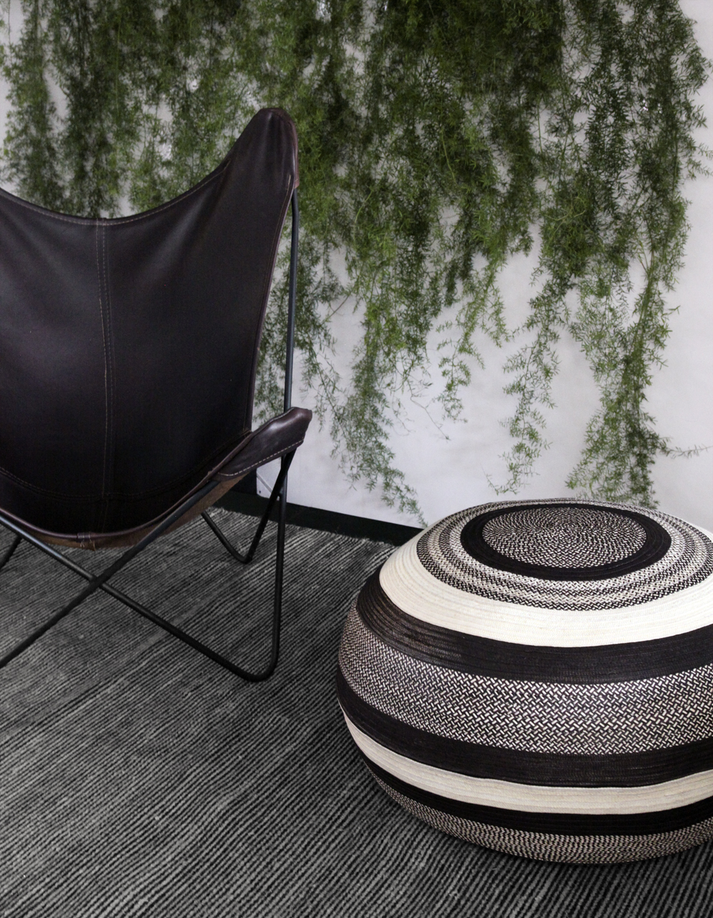 handmade black and white poufs from colombia, round ottomans