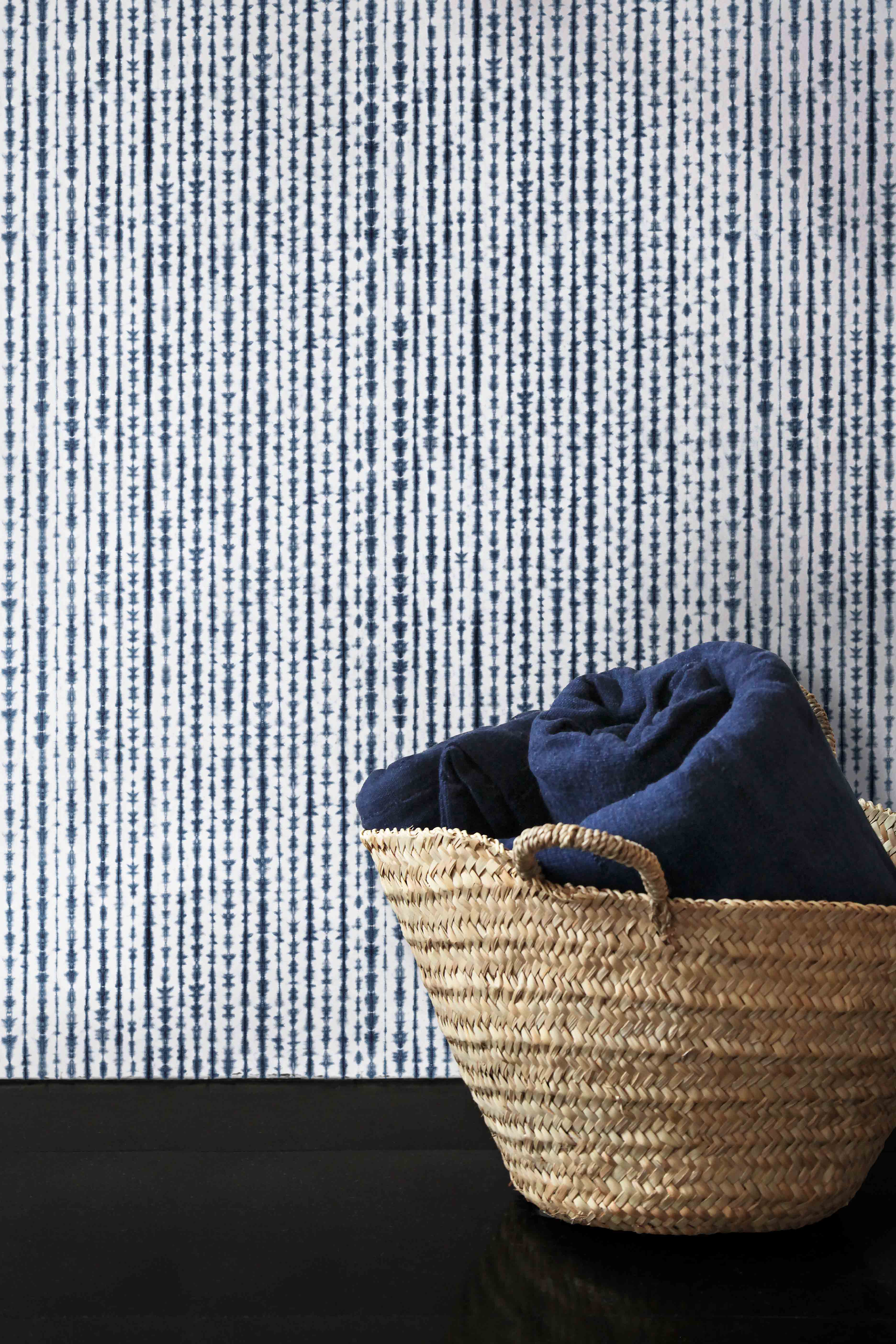 blue indigo wallpaper with patterns inspired by traditional indigo dying.
