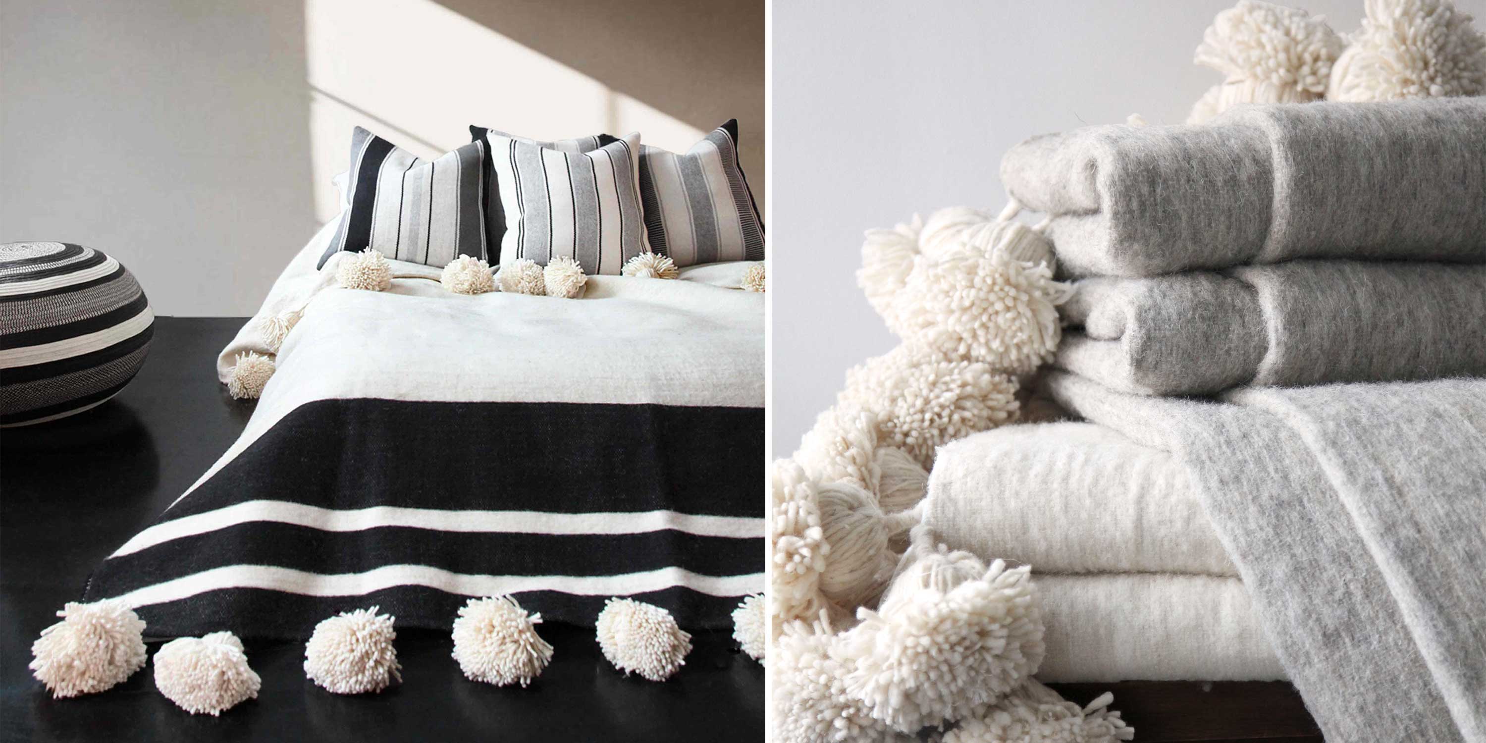 Traditional Moroccan wool blanket with oversized pom poms and alpaca striped throw pillows.