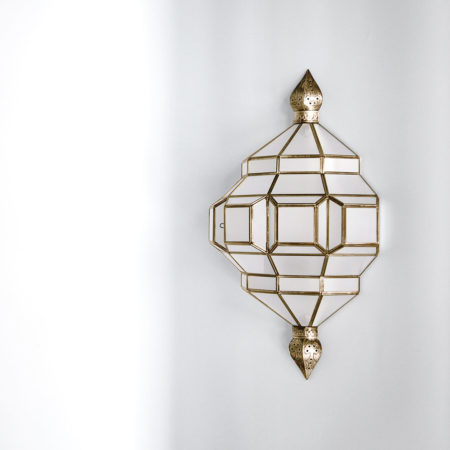 brass and white glass sconce, wall mounted light fixture.