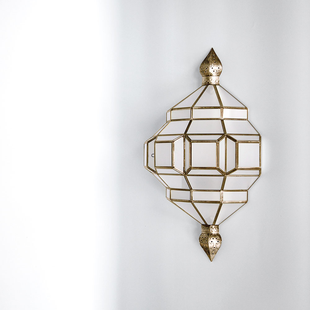 brass and white glass sconce, wall mounted light fixture.