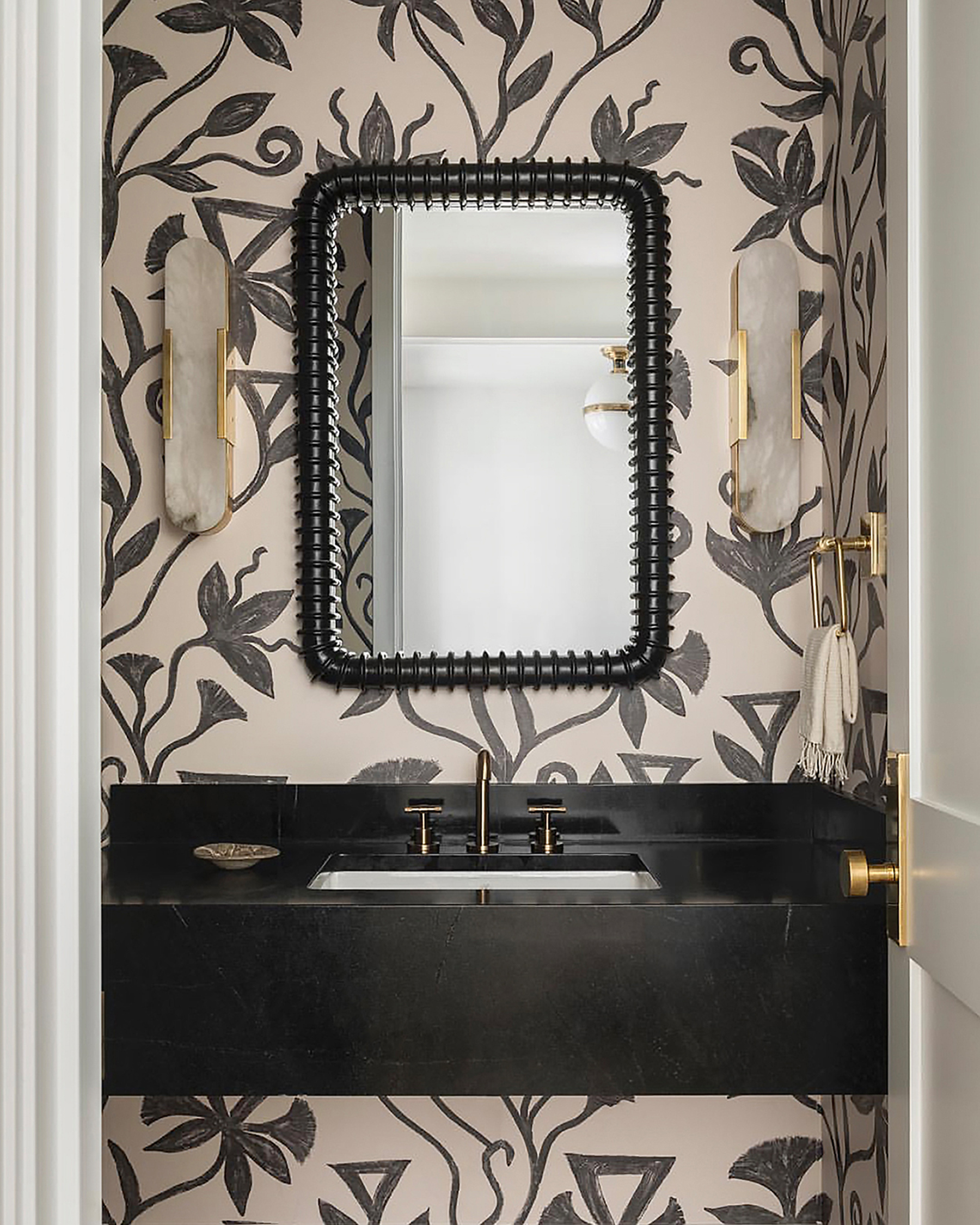 Powder room designed by Brian Paquette with khovar vine wallpaper from l'aviva home.