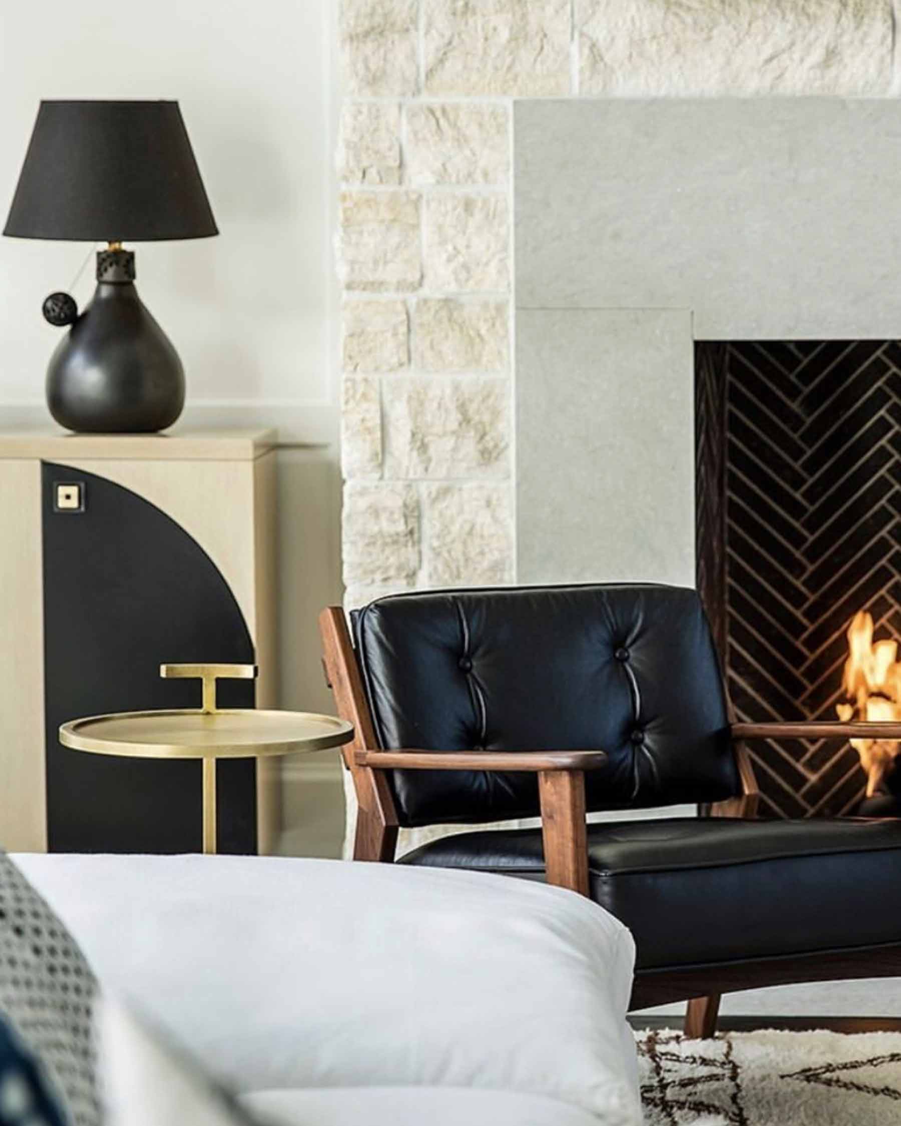 Living room designed by Bonesteel Trout Hall with l'aviva home's barro negro black table lamp.