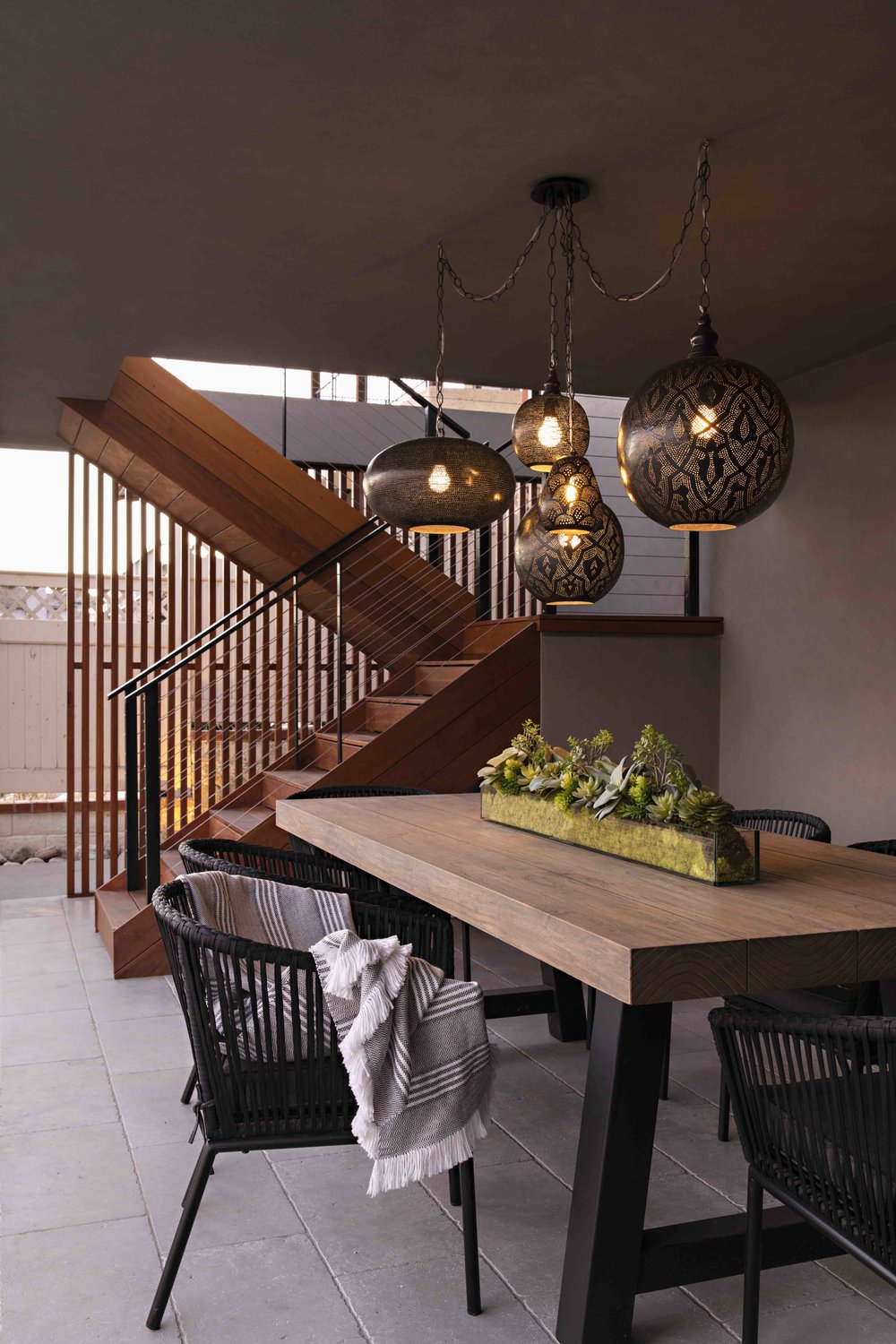 Egyptian Pendants in an outdoor dining area designed by Tidal Interiors