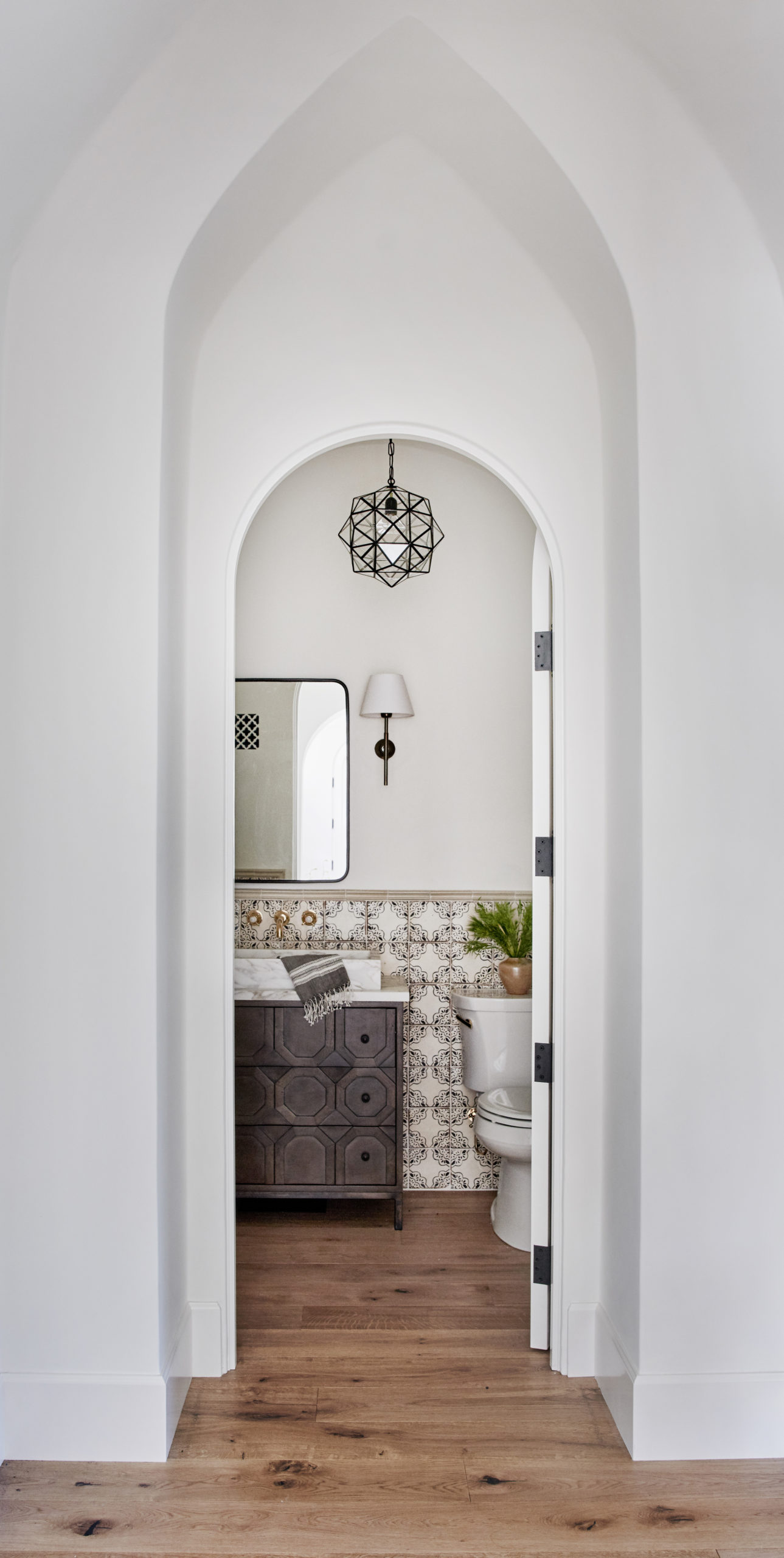 Rombus pendant in a Spanish colonial powder room designed by Amber Interiors