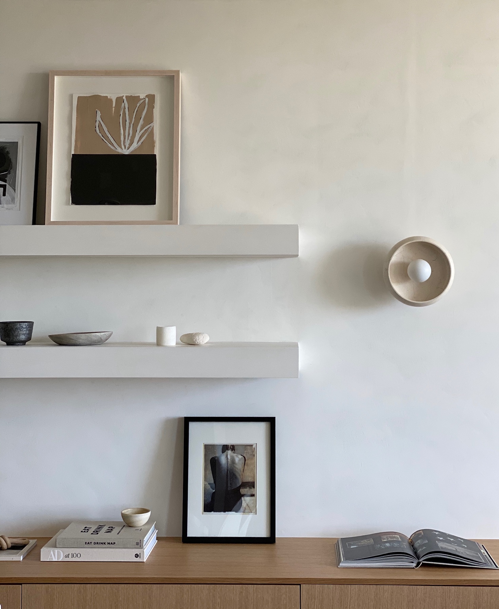Piedra sconce in a minimalist room designed by the Caza Project