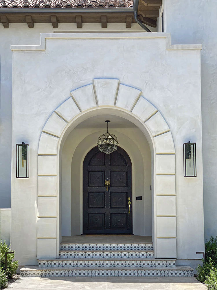 Granada pendant seen in an outdoor vestibule in a spanish colonial designed by Jordan Shields Design