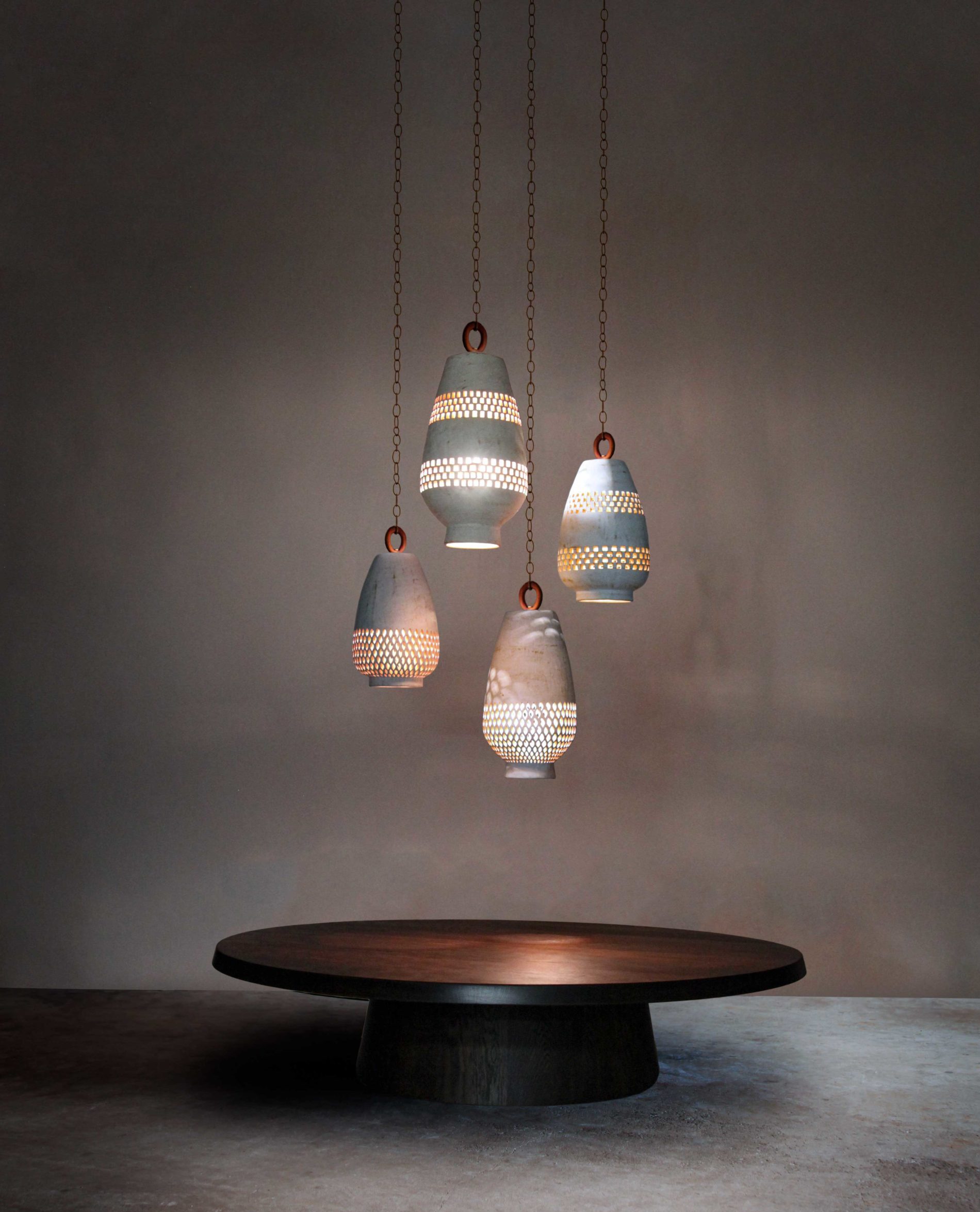 White ceramic pendant lights with geometric cutouts