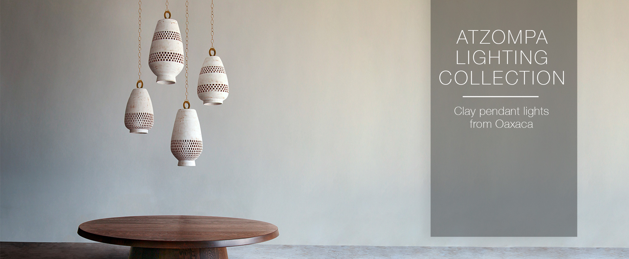 White ceramic pendant lights with geometric cutouts made in Oaxaca