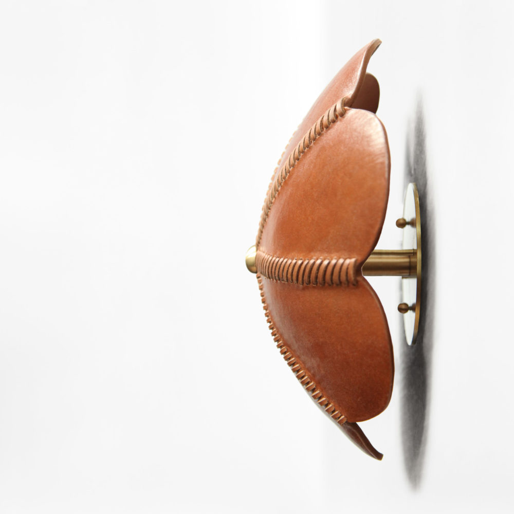 board formed leather sconce