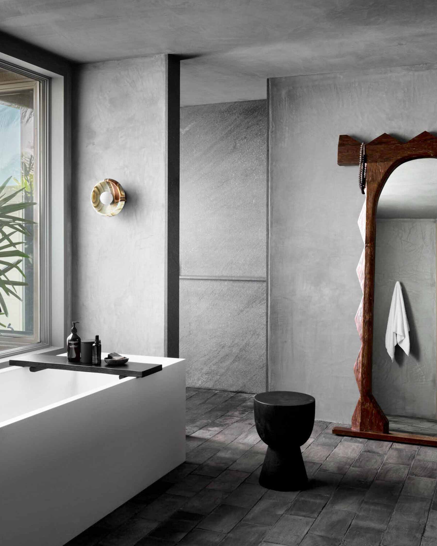 Piedra Terra Sconce made from onyx in a space designed by Nicole Hollis