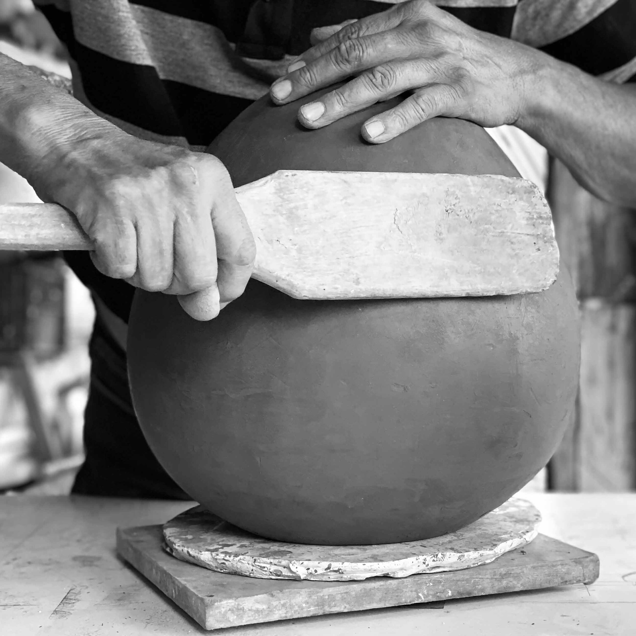 shaping the clay.