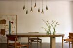 Lirio pendants clustered over a dining room table