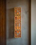 Celosia Sconce lit in hallway