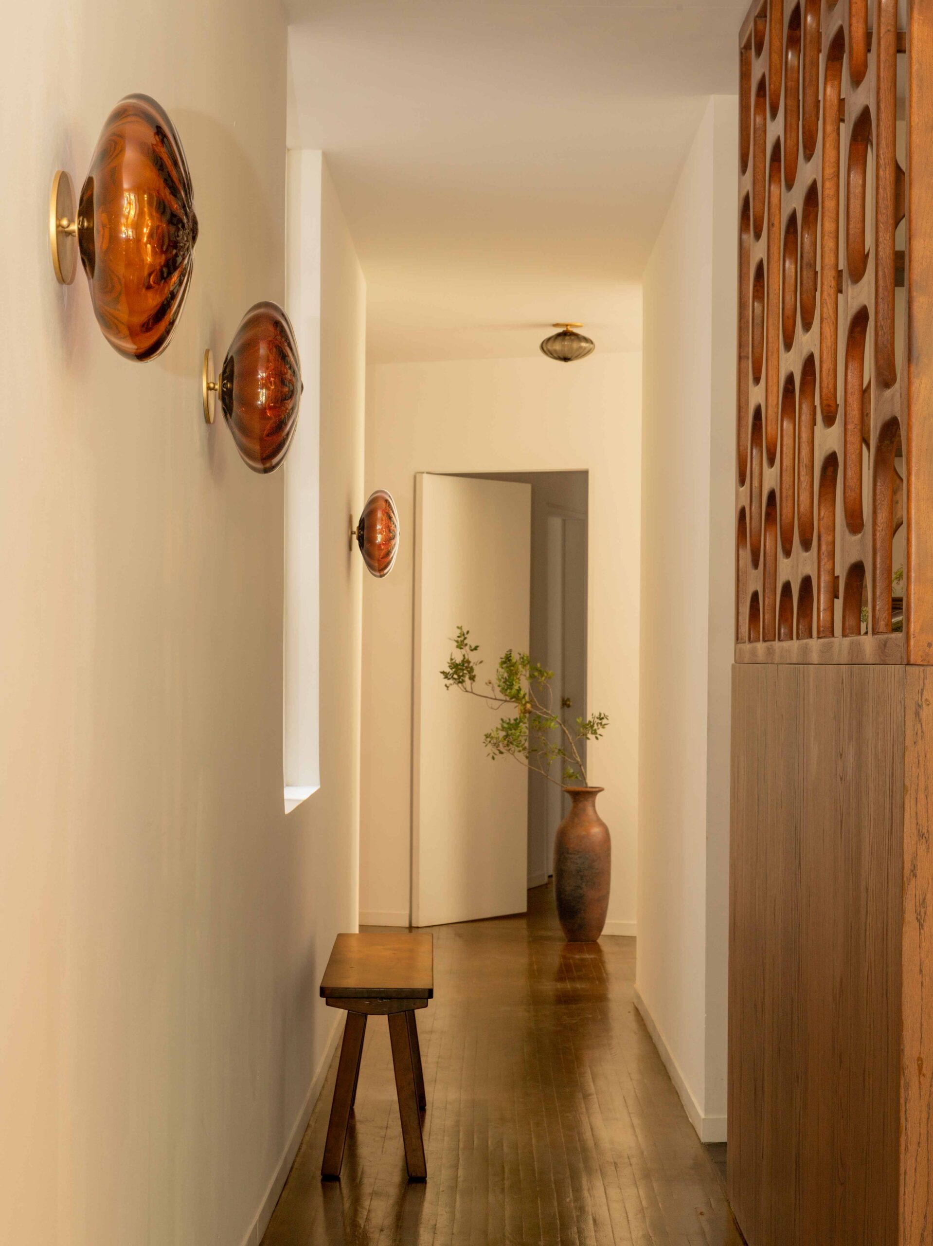 Espadin sconces down a hallway
