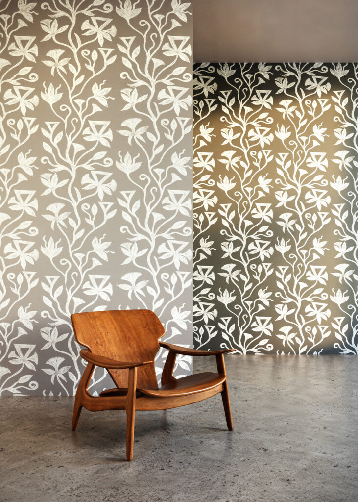 Khovar_Banner_01 This collection draws its inspiration from the tribal villages of Hazaribagh in Northeastern India, where the mud walls of village homes are adorned with expansive, figurative murals. The process begins with a dark earthen base, layered with pale clay. Before the top layer dries, women in the villages brush away the lighter clay using broken combs or their fingers, revealing fluid, organic silhouettes.