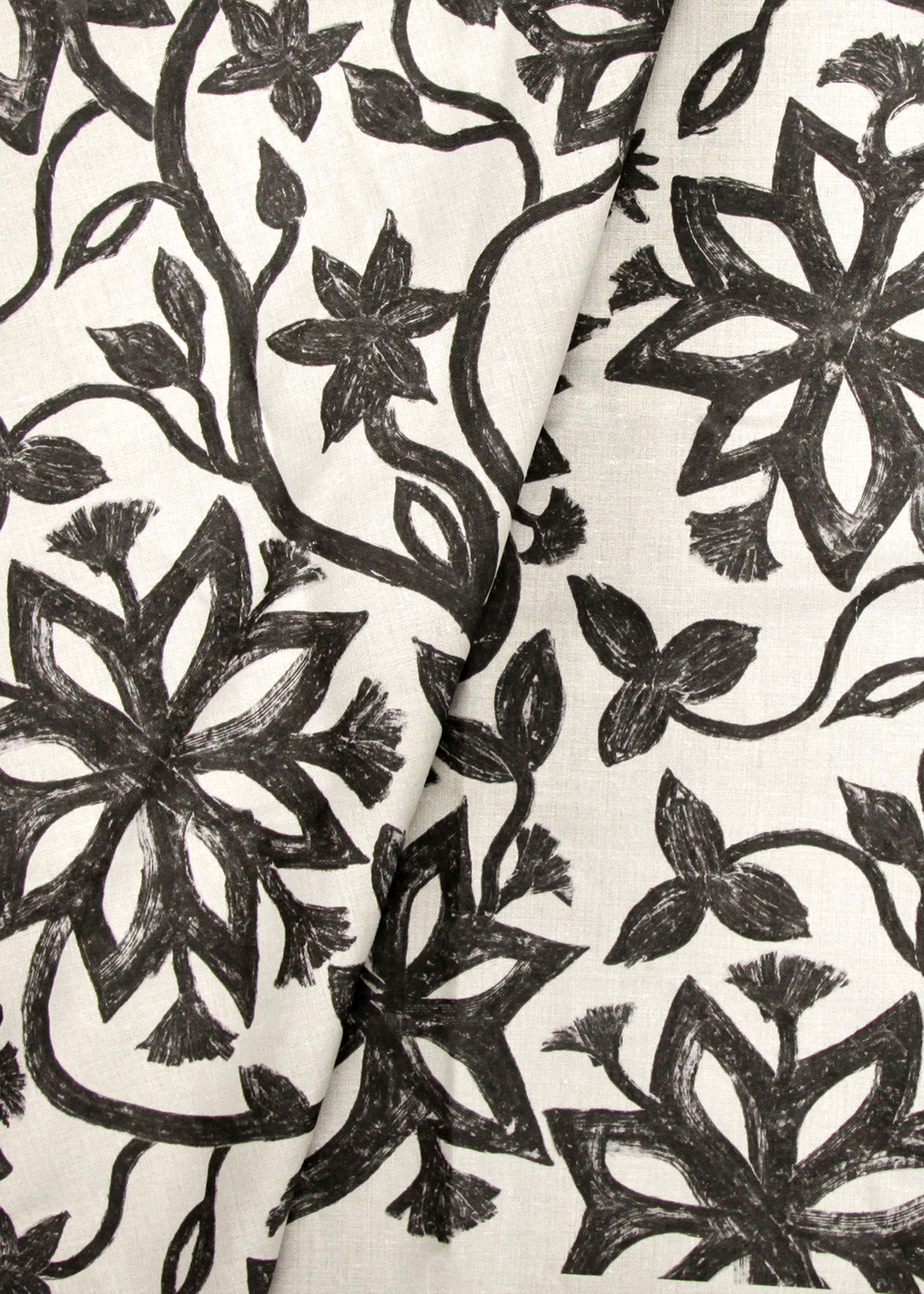 Khovar_Banner_02 This collection draws its inspiration from the tribal villages of Hazaribagh in Northeastern India, where the mud walls of village homes are adorned with expansive, figurative murals. The process begins with a dark earthen base, layered with pale clay. Before the top layer dries, women in the villages brush away the lighter clay using broken combs or their fingers, revealing fluid, organic silhouettes.
